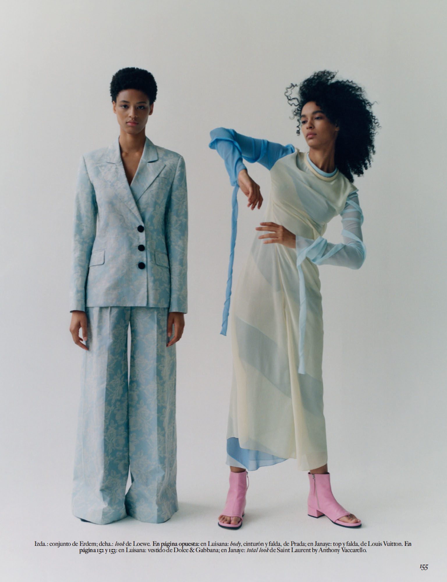 Two models on a white backdrop, one in a pale blue jacquard suit, one in a sheer pastel dress and pink boots, for Vogue Mexico.
