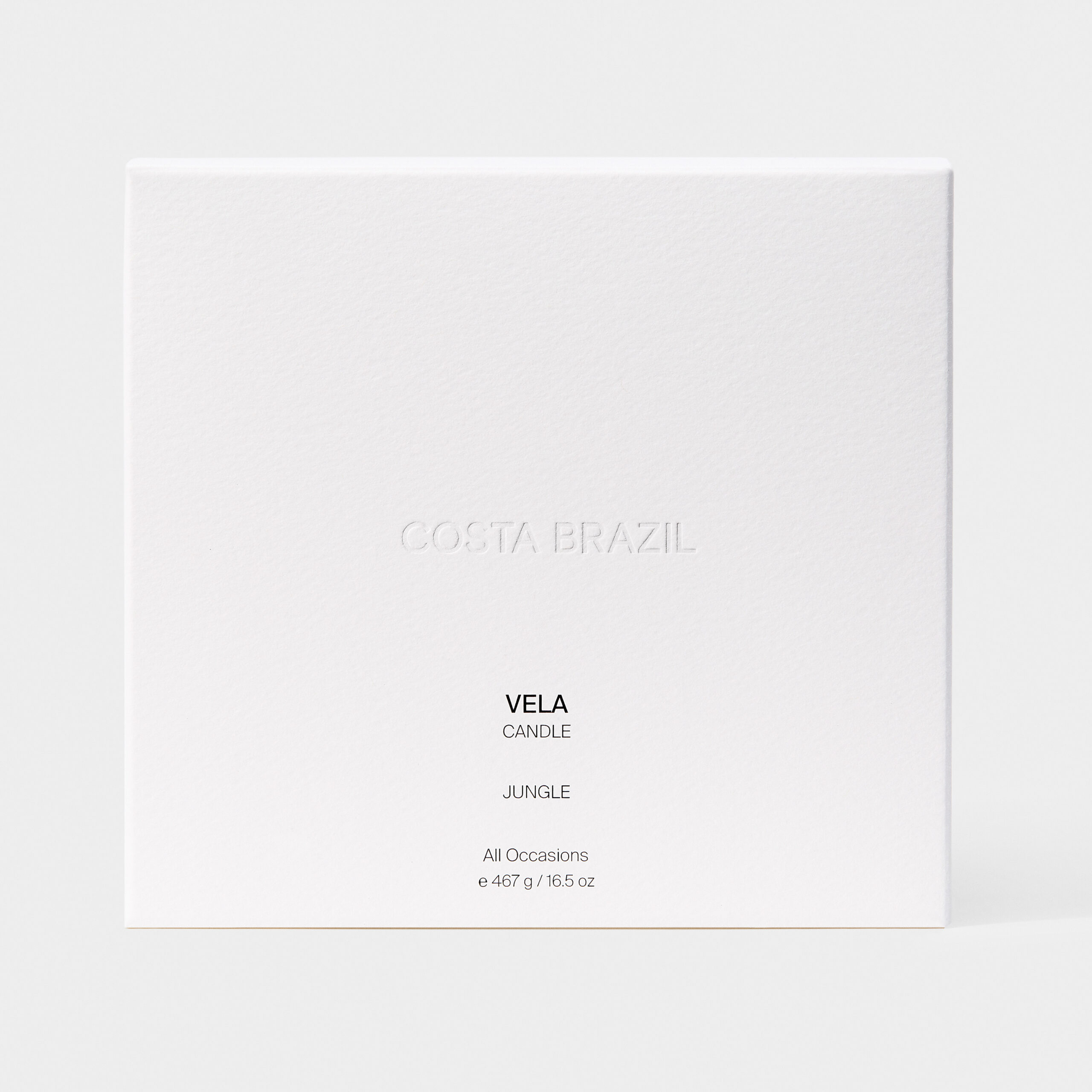 White textured candle box with embossed logo, labelled Vela Candle Jungle, on a pale grey backdrop, for Costa Brazil.