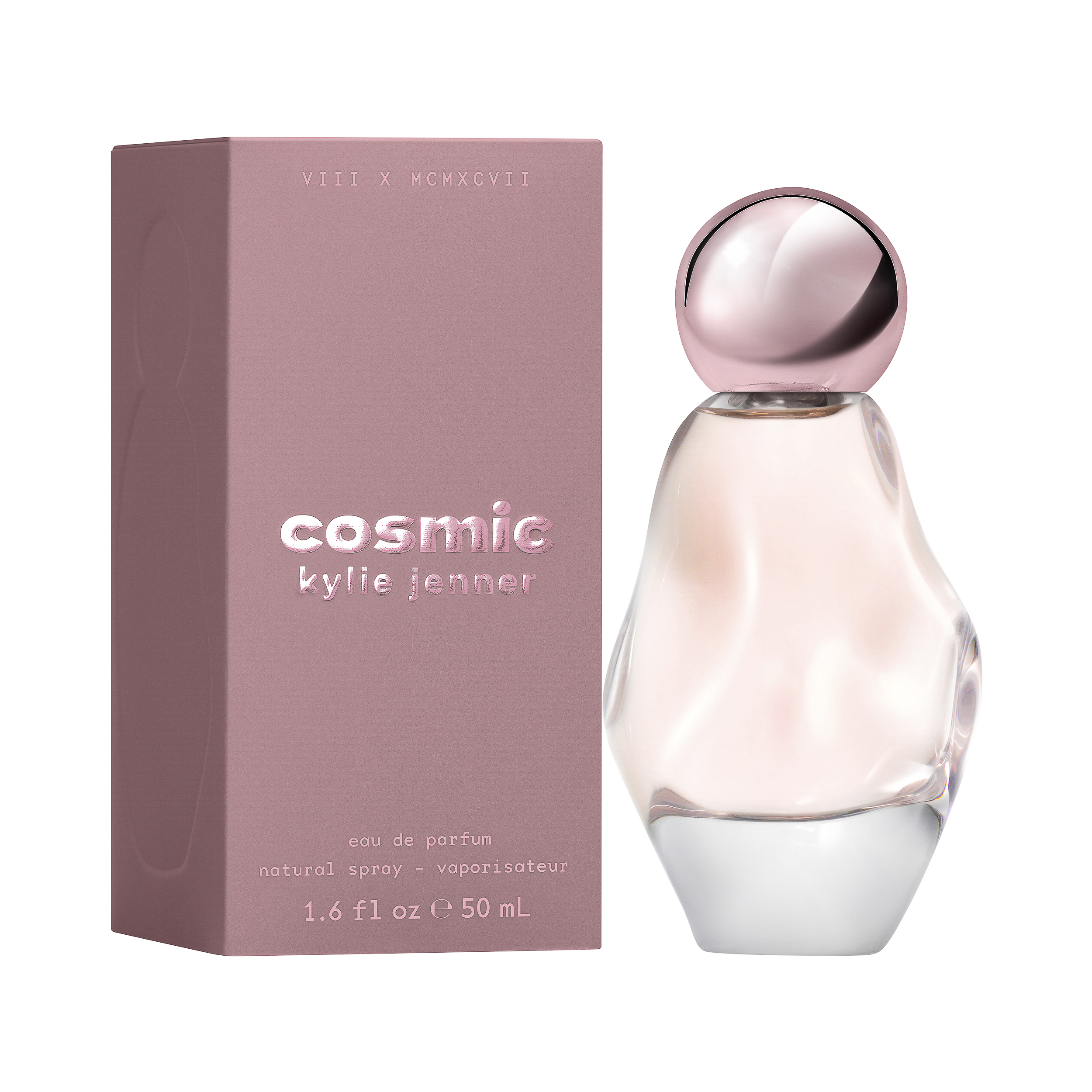 Cosmic eau de parfum in a sculpted pink glass bottle with chrome cap beside its mauve box, for Kylie Cosmetics.
